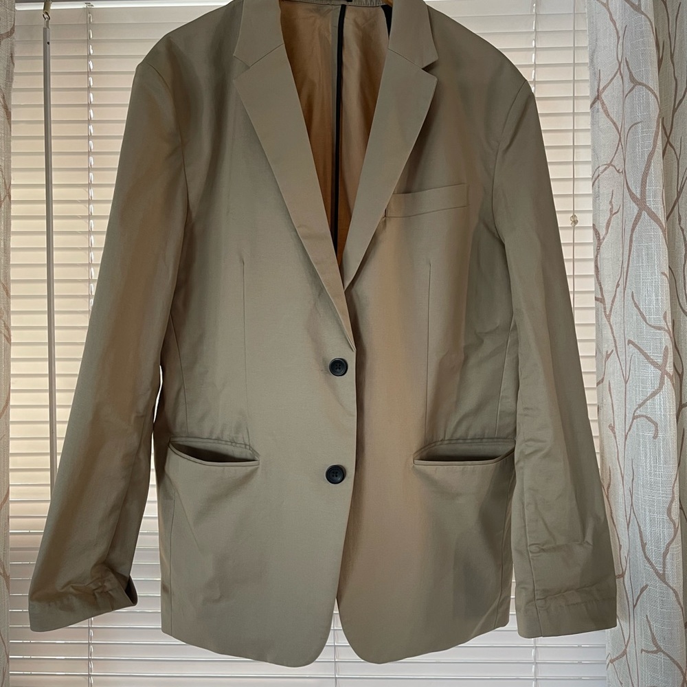 Tan 2 button blazer very light! Size is large it’s similar to slim fit